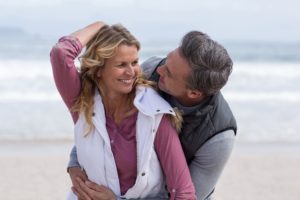 mature-couple-enjoying-on-the-beach