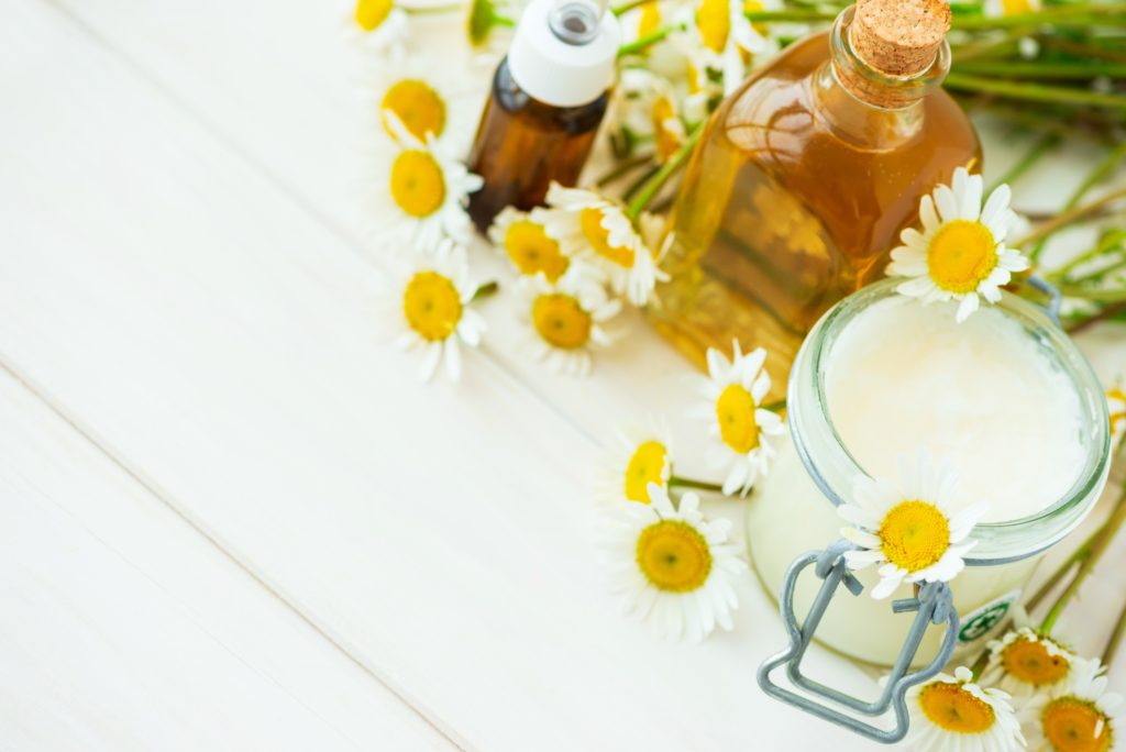 chamomile-flowers-and-cosmetic-bottles-of-essentia