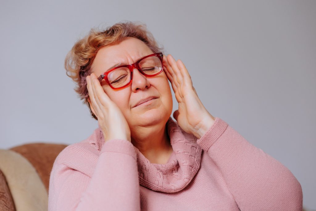 senior-woman-stressed-and-upset-by-chronic-headache