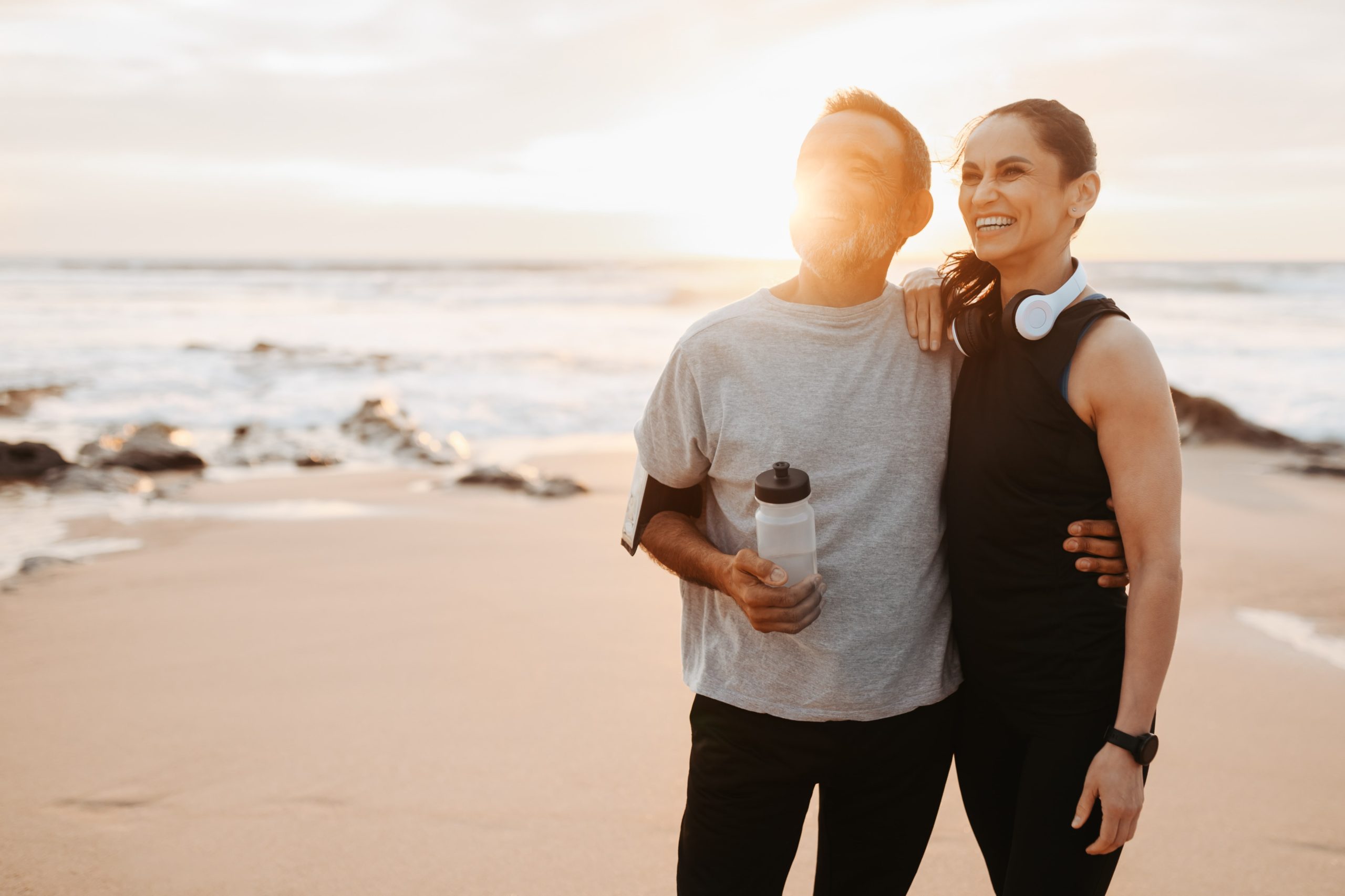 positive-mature-european-couple-hugs-in-sportswear