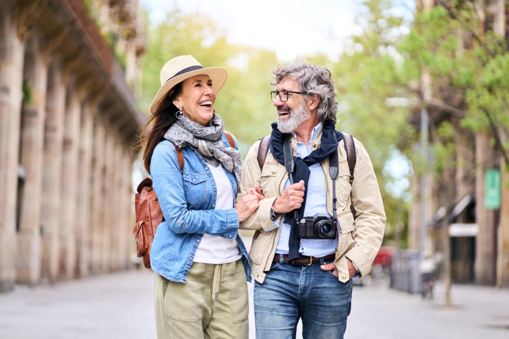 happy-older-couple-having-fun-walking-outdoors