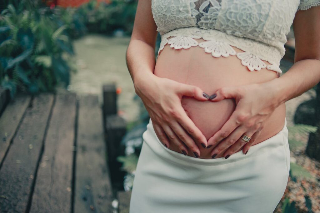 pregnant woman holding her belly