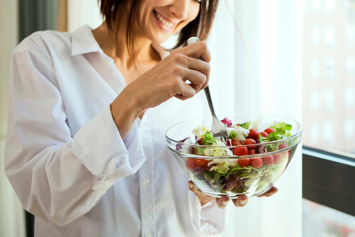 Woman eating salad